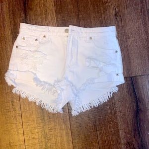 White denim distressed shorts